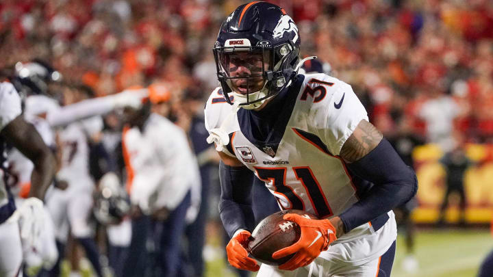 Oct 12, 2023; Kansas City, Missouri, USA; Denver Broncos safety Justin Simmons (31) runs the ball against the Kansas City Chiefs during the game at GEHA Field at Arrowhead Stadium. Mandatory Credit: Denny Medley-USA TODAY Sports