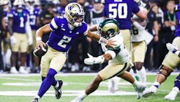 Aug 30, 2025; Seattle, Washington, USA; Washington Huskies quarterback Demond Williams Jr. (2) escapes a potential sack by Colorado State Rams linebacker Jacob Ellis (44) during the second quarter at Husky Stadium. Mandatory Credit: Joe Nicholson-Imagn Images