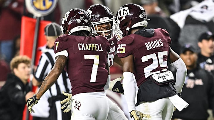 Nov 11, 2023; College Station, Texas, USA; Texas A&M Aggies defensive lineman Fadil Diggs (10), defensive back Tyreek Chappell (7) and Texas A&M Aggies defensive back Dalton Brooks (25) react during the game against the Mississippi State Bulldogs at Kyle Field. 