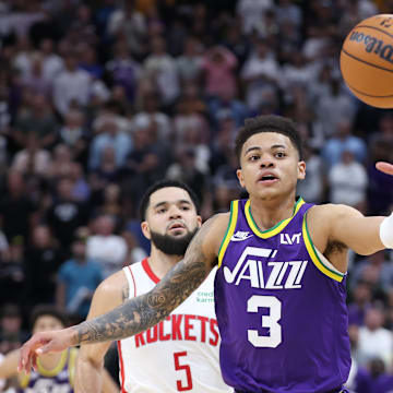 Apr 11, 2024; Salt Lake City, Utah, USA; Utah Jazz guard Keyonte George (3) and Houston Rockets guard Fred VanVleet (5) chase a loose a ball during the fourth quarter at Delta Center. Mandatory Credit: Rob Gray-Imagn Images