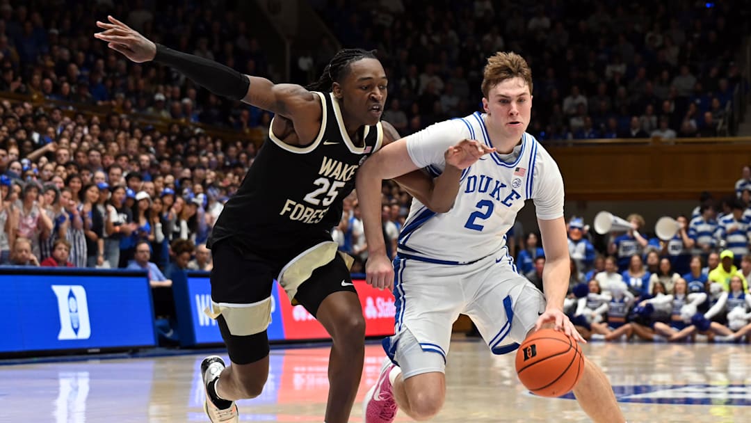 Mar 3, 2025; Durham, North Carolina, USA;  Duke Blue Devils forward Cooper Flagg (2) drives to the basket as Wake Forest Demon Deacons forward Tre'Von Spiller (25) defends during the second half at Cameron Indoor Stadium.  The Blue Devils won 93-60. Mandatory Credit: Rob Kinnan-Imagn Images