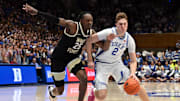 Mar 3, 2025; Durham, North Carolina, USA;  Duke Blue Devils forward Cooper Flagg (2) drives to the basket as Wake Forest Demon Deacons forward Tre'Von Spiller (25) defends during the second half at Cameron Indoor Stadium.  The Blue Devils won 93-60. Mandatory Credit: Rob Kinnan-Imagn Images