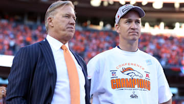 Jan 19, 2014; Denver, CO, USA; Denver Broncos executive vice president of football operations John Elway and quarterback Peyton Manning (18) after the 2013 AFC championship playoff football game against the New England Patriots at Sports Authority Field at Mile High. Mandatory Credit: Matthew Emmons-Imagn Images