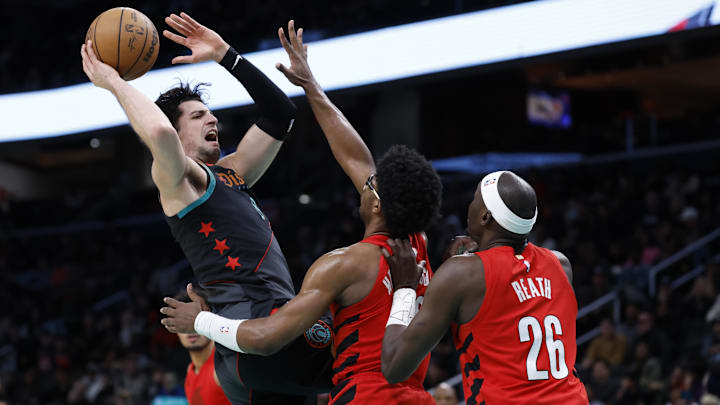 Apr 5, 2024; Washington, District of Columbia, USA; Washington Wizards forward Deni Avdija (8) drives to the basket as Portland Trail Blazers guard Scoot Henderson (00) defends in the second half at Capital One Arena. Mandatory Credit: Geoff Burke-Imagn Images