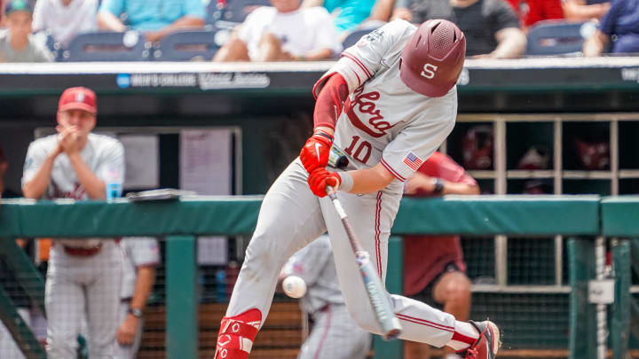 Jun 17, 2023; Omaha, NE, USA; Stanford Cardinal catcher Malcolm Moore (10) hits a single against the Wake Forest Demon Deacons during the sixth inning at Charles Schwab Field Omaha. Mandatory Credit: Dylan Widger-USA TODAY Sports