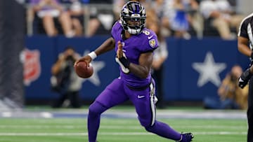 Sep 22, 2024; Arlington, Texas, USA; Baltimore Ravens quarterback Lamar Jackson (8) scrambles during the first quarter against the Dallas Cowboys at AT&T Stadium. Mandatory Credit: Andrew Dieb-Imagn Images