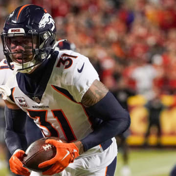 Oct 12, 2023; Kansas City, Missouri, USA; Denver Broncos safety Justin Simmons (31) runs the ball against the Kansas City Chiefs during the game at GEHA Field at Arrowhead Stadium. Mandatory Credit: Denny Medley-USA TODAY Sports