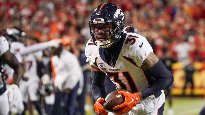 Oct 12, 2023; Kansas City, Missouri, USA; Denver Broncos safety Justin Simmons (31) runs the ball against the Kansas City Chiefs during the game at GEHA Field at Arrowhead Stadium. Mandatory Credit: Denny Medley-USA TODAY Sports