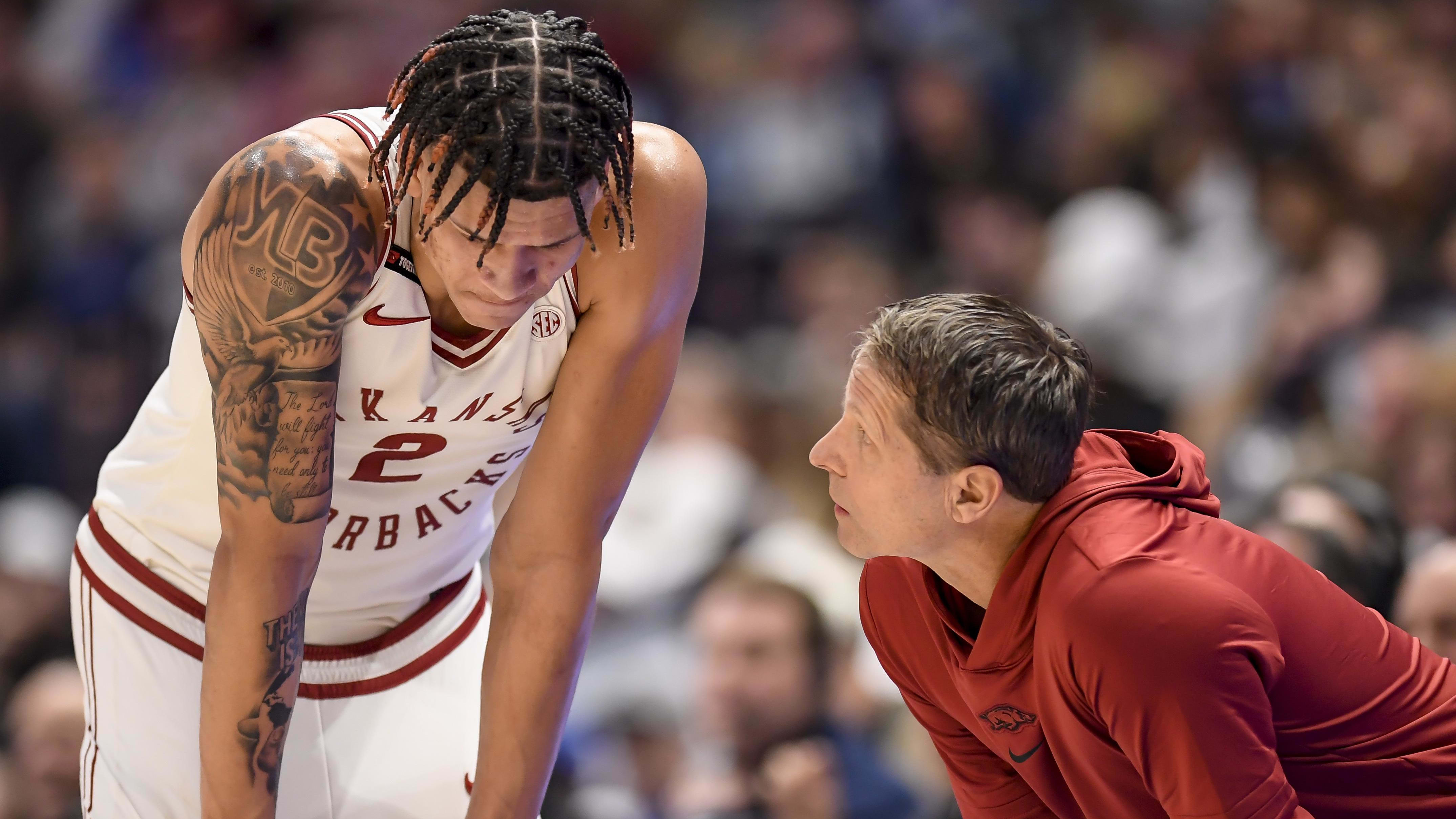 Arkansas Razorbacks head coach Eric Musselman talks with forward Trevon Brazile.