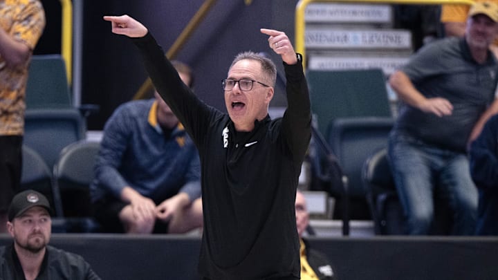 Dec 1, 2024; Estero, FL, USA; West Virginia University head coach Mark Kellogg calls a play in the from the sidelines in the fourth quarter during the Women's Gulf Coast Showcase at Hertz Arena. Mandatory Credit: Chris Tilley-Imagn Images