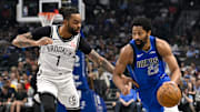 Mar 31, 2025; Dallas, Texas, USA; Dallas Mavericks guard Spencer Dinwiddie (26) brings the ball up court past Brooklyn Nets guard D'Angelo Russell (1) during the first quarter at the American Airlines Center. Mandatory Credit: Jerome Miron-Imagn Images