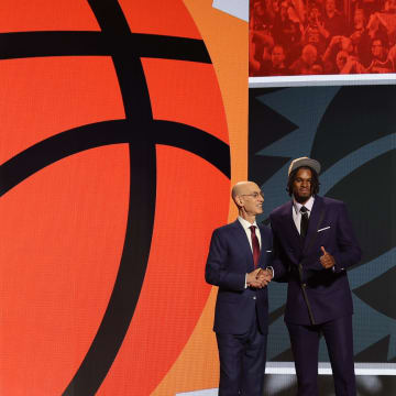 Jun 26, 2024; Brooklyn, NY, USA; DaRon Holmes ll poses for photos with NBA commissioner Adam Silver after being selected in the first round by the Phoenix Suns in the 2024 NBA Draft at Barclays Center. Mandatory Credit: Brad Penner-USA TODAY Sports