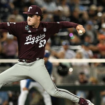 Jun 19, 2024; Omaha, NE, USA;  Texas A&M Aggies pitcher Evan Aschenbeck (53) throws against the Florida Gators during the eighth inning at Charles Schwab Field Omaha. Mandatory Credit: Steven Branscombe-USA TODAY Sports