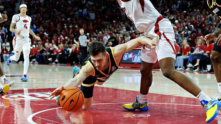 Arkansas senior guard Johnell Davis forces Missouri Caleb Grill into a turnover during Saturday's 92-85 Razorback victory at Bud Walton Arena