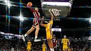 Mar 1, 2025; Starkville, Mississippi, USA; Mississippi State Bulldogs guard Riley Kugel (2) dunks the ball against LSU Tigers forward Daimion Collins (10) during the second half at Humphrey Coliseum. 