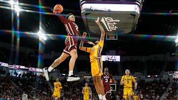 Mar 1, 2025; Starkville, Mississippi, USA; Mississippi State Bulldogs guard Riley Kugel (2) dunks the ball against LSU Tigers forward Daimion Collins (10) during the second half at Humphrey Coliseum. 