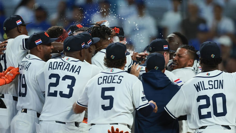 Netherlands players celebrate a walk-off three-run home run by second baseman Ozzie Albies.