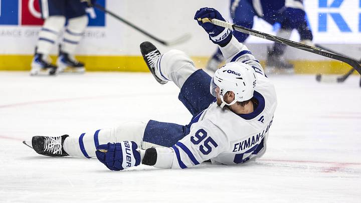 Feb 25, 2026; Tampa, Florida, USA; Toronto Maple Leafs defenseman Oliver Ekman-Larsson (95) falls against the Tampa Bay Lightning during the third period at Benchmark International Arena. Mandatory Credit: Morgan Tencza-Imagn Images