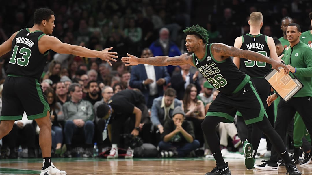 Dec 2, 2022; Boston, Massachusetts, USA; Boston Celtics guard Marcus Smart (36) congratulates guard Malcolm Brogdon (13) after a basket during the second half at TD Garden. Mandatory Credit: Bob DeChiara-Imagn Images
