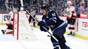 Dec 28, 2024; Winnipeg, Manitoba, CAN; Winnipeg Jets center Mark Scheifele (55) celebrates his second period goal against the Ottawa Senators at Canada Life Centre. Mandatory Credit: James Carey Lauder-Imagn Images