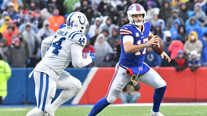 Nov 21, 2021; Orchard Park, New York, USA; Buffalo Bills quarterback Josh Allen (17) runs from Indianapolis Colts outside linebacker Zaire Franklin (44) in the third quarter at Highmark Stadium. Mandatory Credit: Mark Konezny-Imagn Images