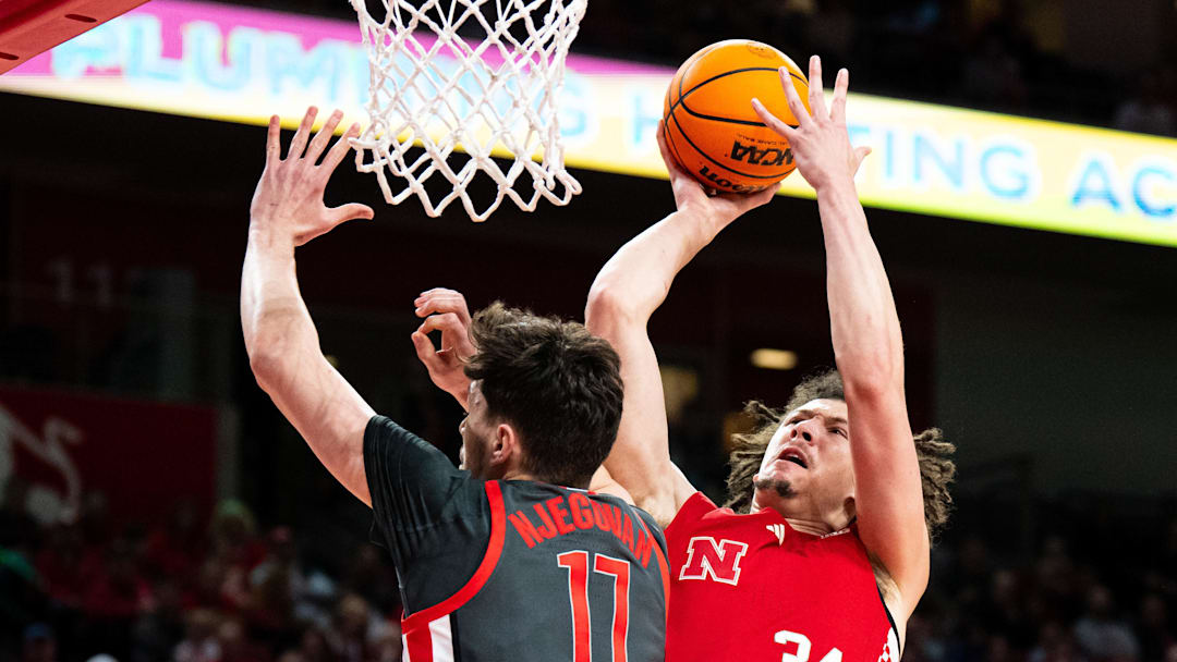 Feb 9, 2025; Lincoln, Nebraska, USA; Nebraska Cornhuskers center Braxton Meah (34) shoots the ball against Ohio State Buckeyes center Ivan Njegovan (17) during the first half at Pinnacle Bank Arena. Mandatory Credit: Dylan Widger-Imagn Images