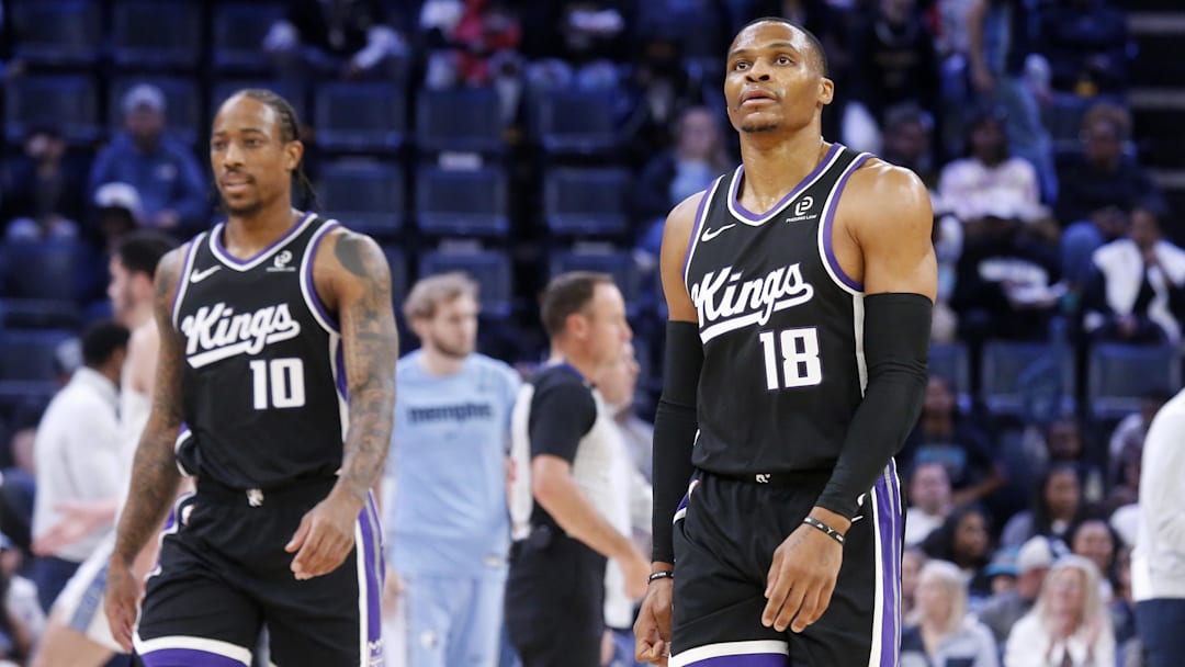 Nov 20, 2025; Memphis, Tennessee, USA; Sacramento Kings guard DeMar DeRozan (10) and guard Russell Westbrook (18) walk toward the bench during a timeout during the first quarter against the Memphis Grizzlies at FedExForum. Mandatory Credit: Petre Thomas-Imagn Images
