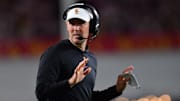 Oct 7, 2023; Los Angeles, California, USA; Southern California Trojans head coach Lincoln Riley watches game action against the Arizona Wildcats during the first half at Los Angeles Memorial Coliseum. Mandatory Credit: Gary A. Vasquez-Imagn Images