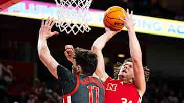 Feb 9, 2025; Lincoln, Nebraska, USA; Nebraska Cornhuskers center Braxton Meah (34) shoots the ball against Ohio State Buckeyes center Ivan Njegovan (17) during the first half at Pinnacle Bank Arena. Mandatory Credit: Dylan Widger-Imagn Images