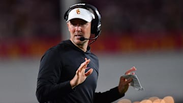 Oct 7, 2023; Los Angeles, California, USA; Southern California Trojans head coach Lincoln Riley watches game action against the Arizona Wildcats during the first half at Los Angeles Memorial Coliseum. Mandatory Credit: Gary A. Vasquez-Imagn Images