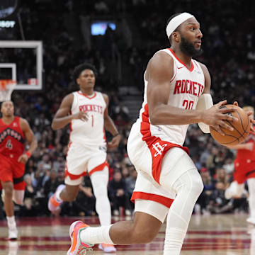 Oct 29, 2025; Toronto, Ontario, CAN; Houston Rockets forward Josh Okogie (20) drives to the net against the Toronto Raptors during the second half at Scotiabank Arena. Mandatory Credit: John E. Sokolowski-Imagn Images