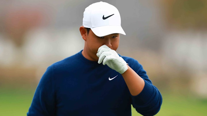 Tom Kim of South Korea looks dejected after losing the first playoff hole against Byeong Hun An at the 2024 Genesis Championship. Tom Kim of South Korea looks dejected after losing the first playoff hole against Byeong Hun An at the 2024 Genesis Championship.