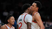 Dec 3, 2024; Coral Gables, Florida, USA; Miami Hurricanes forward Brandon Johnson (2) celebrates with center Lynn Kidd (1) after scoring against the Arkansas Razorbacks during the second half at Watsco Center.