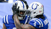 Indianapolis Colts cornerback Xavien Howard (4) and safety Camryn Bynum (0) celebrate after Bynum forces a turn over against the Miami Dolphins during the first half of a game Sunday, Sept. 7, 2025, at Lucas Oil Stadium in Indianapolis.