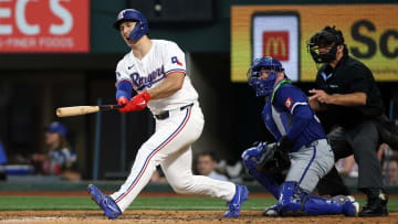 Jun 22, 2024; Arlington, Texas, USA; Texas Rangers left fielder Wyatt Langford (36) reacts after hitting a bal off his foot in the eighth inning against the Kansas City Royals at Globe Life Field. 