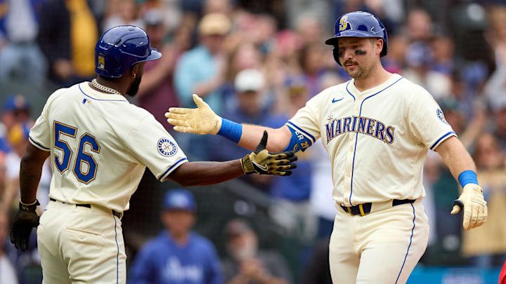 Sep 14, 2025; Seattle, Washington, USA;  Seattle Mariners catcher Cal Raleigh (29) is greeted by left fielder Randy Arozarena (56) on his two-run home run off in the first inning  against the Los Angeles Angels at T-Mobile Park. Mandatory Credit: John Froschauer-Imagn Images