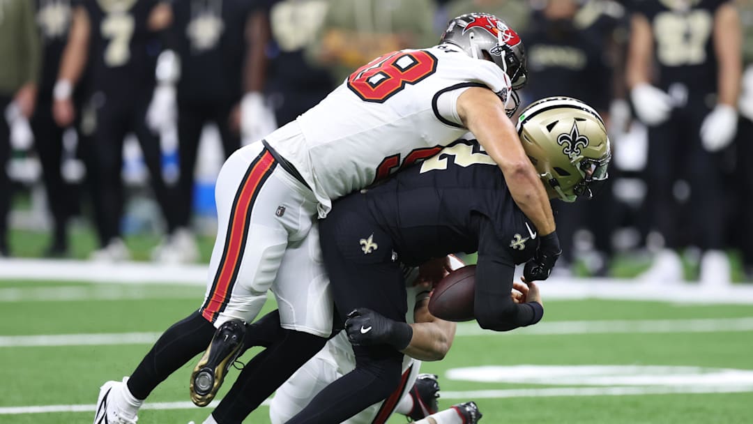 Oct 26, 2025; New Orleans, Louisiana, USA; New Orleans Saints quarterback Spencer Rattler (2) is sacked by Tampa Bay Buccaneers linebacker Anthony Nelson (98) during the first quarter at Caesars Superdome. Mandatory Credit: Stephen Lew-Imagn Images