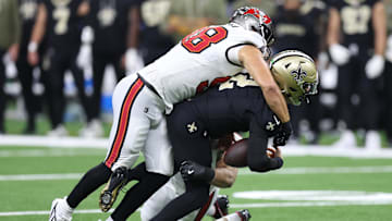 Oct 26, 2025; New Orleans, Louisiana, USA; New Orleans Saints quarterback Spencer Rattler (2) is sacked by Tampa Bay Buccaneers linebacker Anthony Nelson (98) during the first quarter at Caesars Superdome. Mandatory Credit: Stephen Lew-Imagn Images