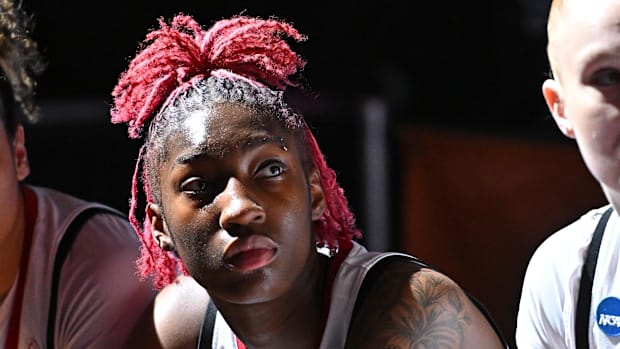 NC State Wolfpack guard Saniya Rivers looks on from the bench while wearing her uniform