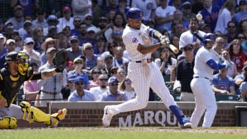 May 19, 2024; Chicago, Illinois, USA; Chicago Cubs third baseman Christopher Morel (5) hits a RBI sacrifice against the Pittsburgh Pirates during the sixth inning at Wrigley Field. Mandatory Credit: David Banks-USA TODAY Sports