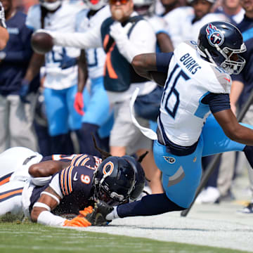 Tennessee Titans wide receiver Treylon Burks (16) is knocked out of bounds by Chicago Bears safety Jaquan Brisker (9) at Soldier Field in Chicago, Ill., Sunday, Sept. 8, 2024.