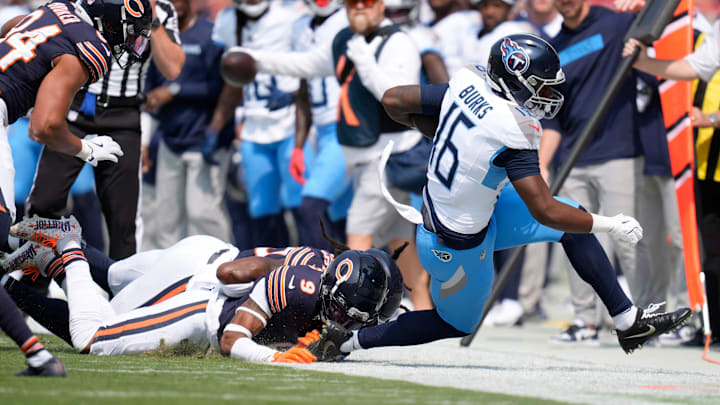 Tennessee Titans wide receiver Treylon Burks (16) is knocked out of bounds by Chicago Bears safety Jaquan Brisker (9) at Soldier Field in Chicago, Ill., Sunday, Sept. 8, 2024.