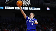 Mar 22, 2025; Wichita, KS, USA; Drake Bulldogs guard Bennett Stirtz (14) shoots the ball against the Texas Tech Red Raiders during the second half at Intrust Bank Arena. Mandatory Credit: Nick Tre. Smith-Imagn Images