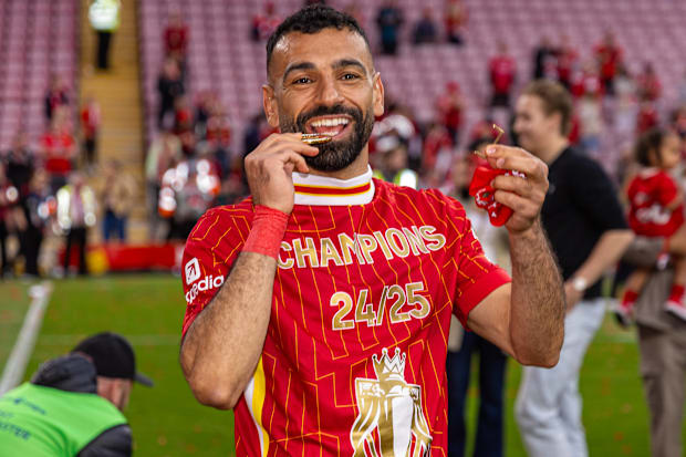 Mohamed Salah celebrating with his Premier League winners’ medal.