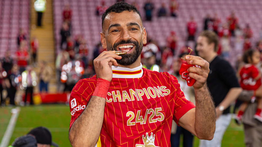 Mohamed Salah celebrating with his Premier League winners’ medal.