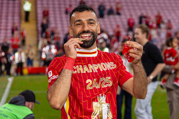 Mohamed Salah celebrating with his Premier League winners’ medal.