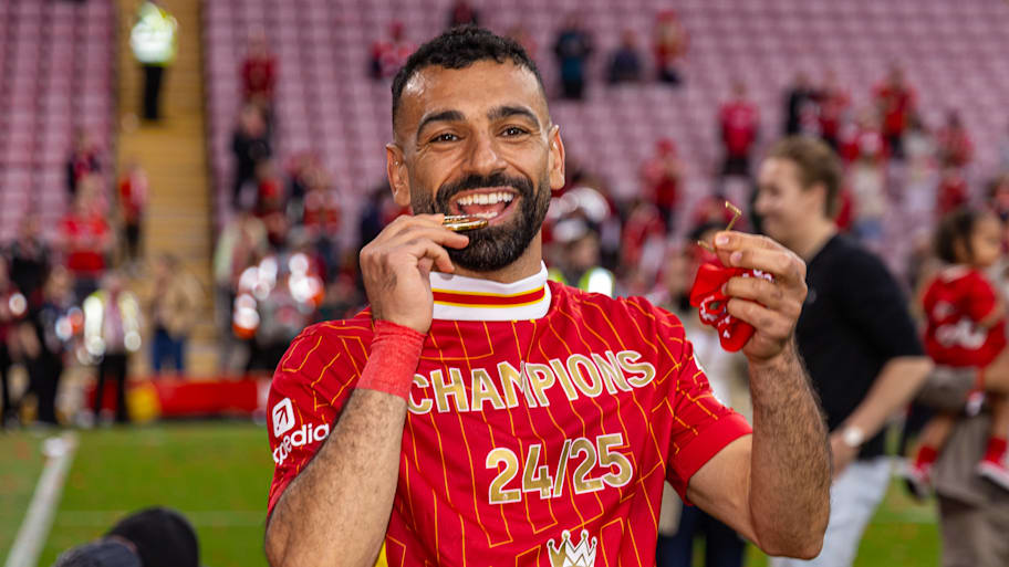Mohamed Salah celebrating with his Premier League winners’ medal.
