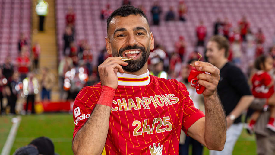 Mohamed Salah celebrating with his Premier League winners’ medal.