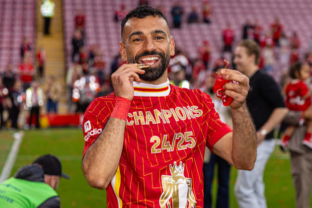 Mohamed Salah celebrating with his Premier League winners’ medal.