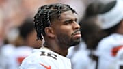 Aug 23, 2025; Cleveland, Ohio, USA; Cleveland Browns quarterback Shedeur Sanders (12) listens to the national anthem before the game between the Browns and the Los Angeles Rams at Huntington Bank Field. Mandatory Credit: Ken Blaze-Imagn Images